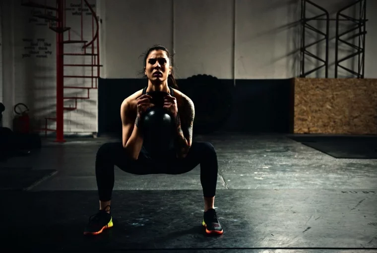 a woman doing goblet squats