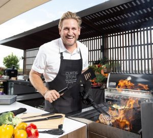 curtis stone cooking in his kitchen