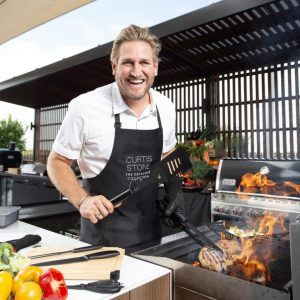 curtis stone cooking in his kitchen