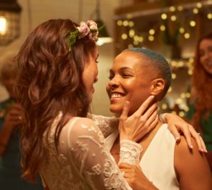 a couple on their wedding day embracing each other