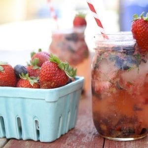 a healthy beverage with a pint of strawberries
