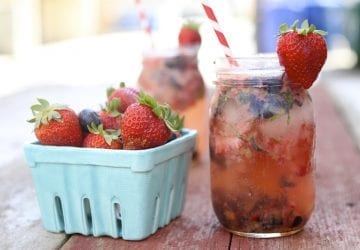 a healthy beverage with a pint of strawberries