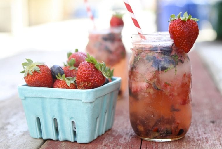 a healthy beverage with a pint of strawberries