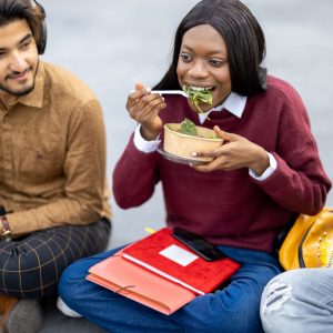 a group of students eating a healthy meal
