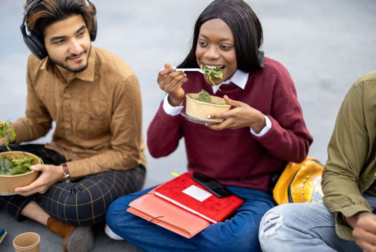 a group of students eating a healthy meal
