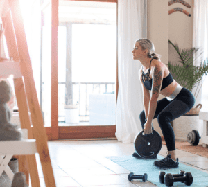 a woman exercising at home in her home gym
