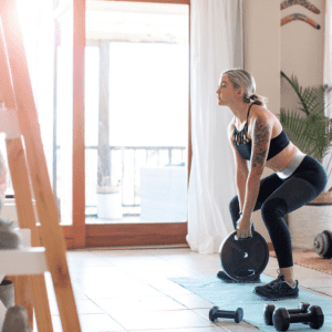 a woman exercising at home in her home gym