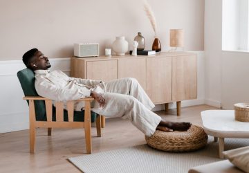 a man relaxing in a brightly lit room
