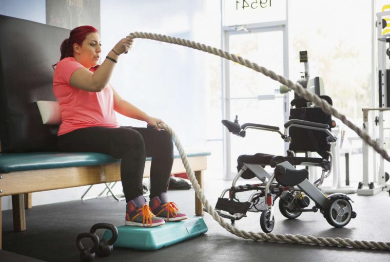 a woman with limited mobility exercising