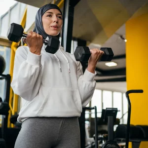 a muslim woman wearing a hijab working out