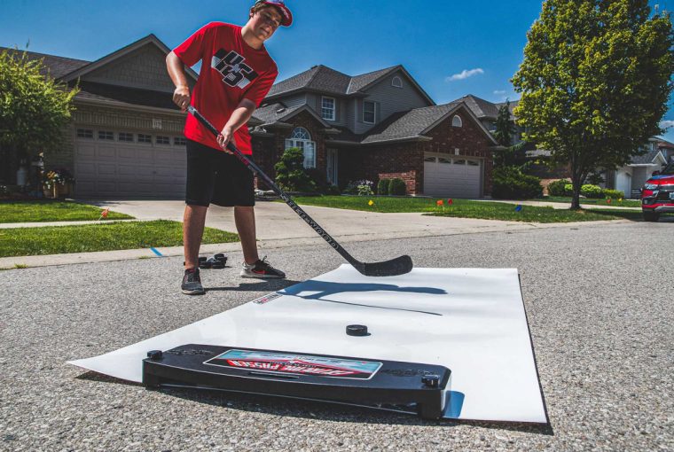 a young hockey player practicing his shooting skills