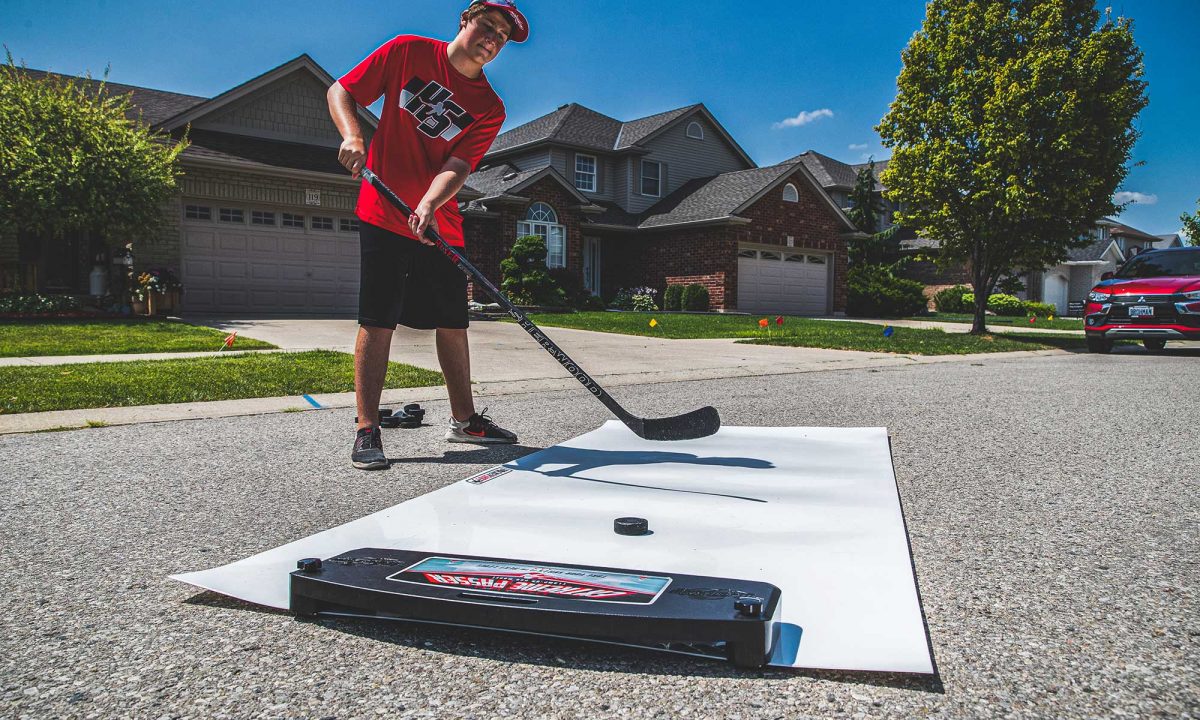 a young hockey player practicing his shooting skills