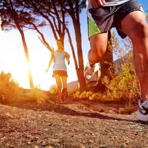 a pair of runners on an outdoor trail