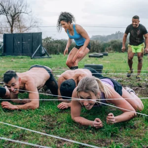 a group of athletes training for an obstacle course race