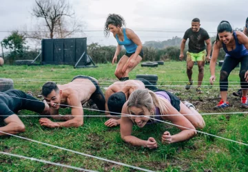 a group of athletes training for an obstacle course race
