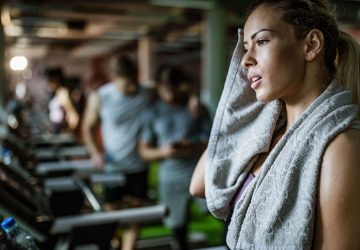a woman sweating at the gym