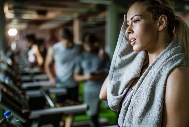 a woman sweating at the gym