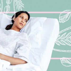 a woman laying in a hospital bed