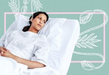 a woman laying in a hospital bed