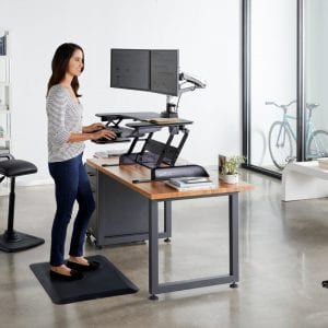 Woman standing at a desk