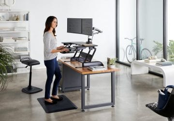 Woman standing at a desk