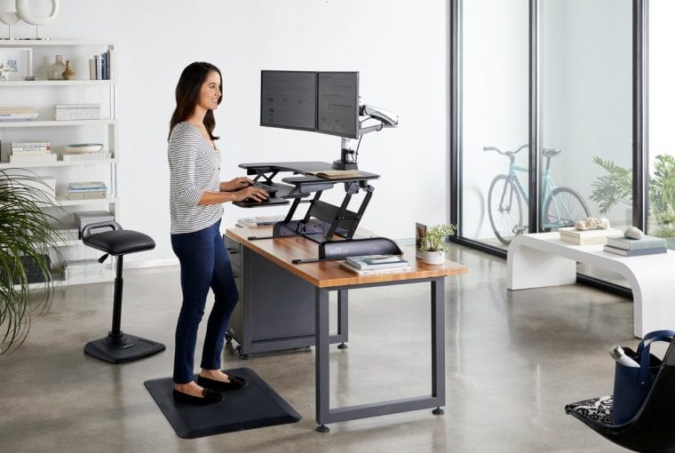 Woman standing at a desk