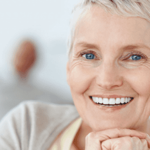 senior lady in the foreground with a healthy smile