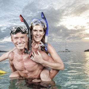 Happy couple in the ocean