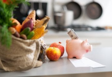piggy bank in front of healthy food