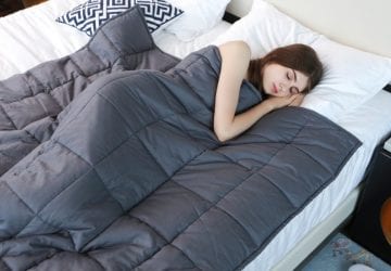 Lady sleeping with weighted blanket