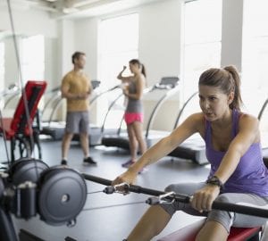 people exercising in their condo gym