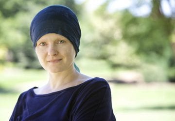 woman with cancer wearing a headband