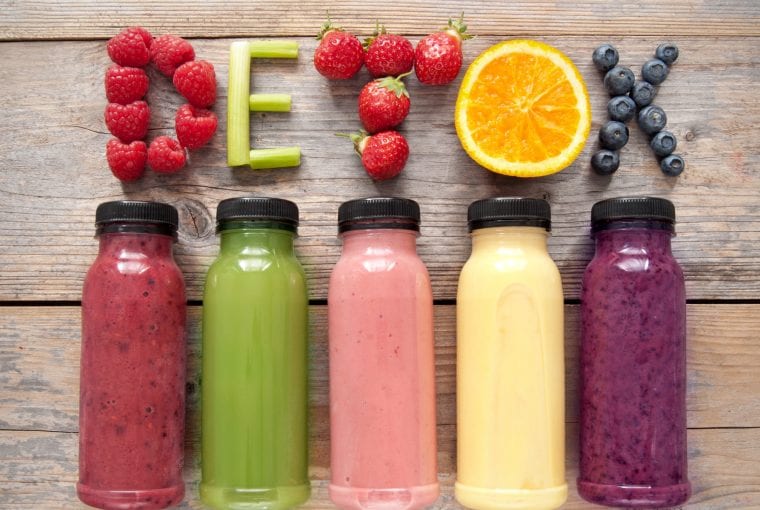 bottles of fresh juice with the word detox
