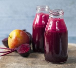 fruits and vegetables beside juice bottled