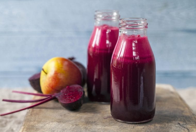 fruits and vegetables beside juice bottled
