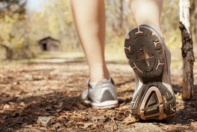 woman walking towards cabin
