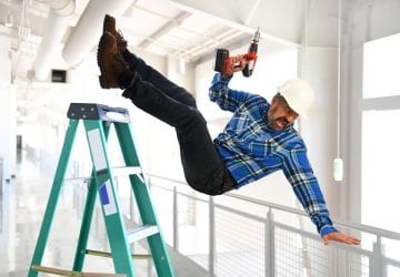 man falling off a ladder at work