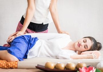 woman lying on her back getting a massage