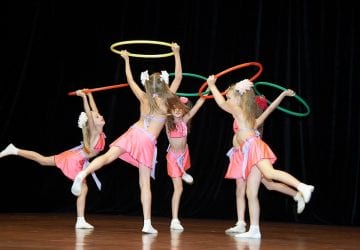 children dancing with hula hoops