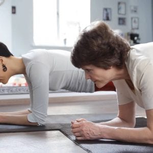 a couple doing planks at home