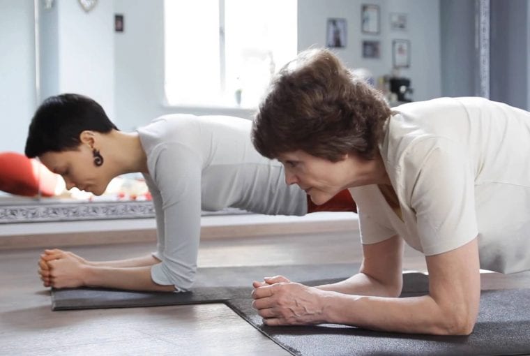 a couple doing planks at home