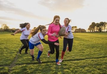 a group of girls playing rugby