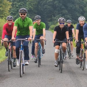 a group of adults riding bikes
