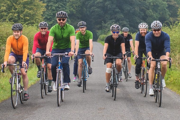 a group of adults riding bikes