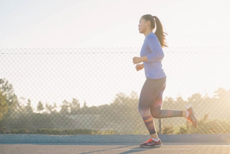 woman going for a run in a park