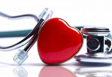 a heart sitting beside a stethoscope