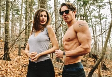 man and a woman flexing showing their arm muscles