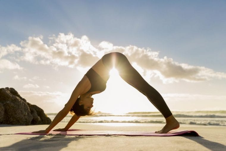 woman doing downward dog yoga position