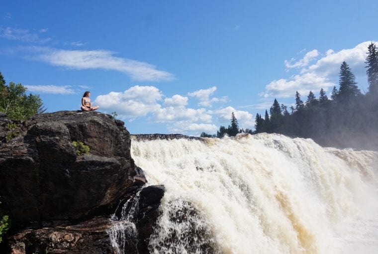 yoga next to a waterfall