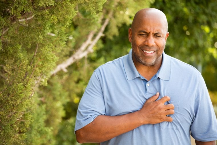 man experiencing heart burn